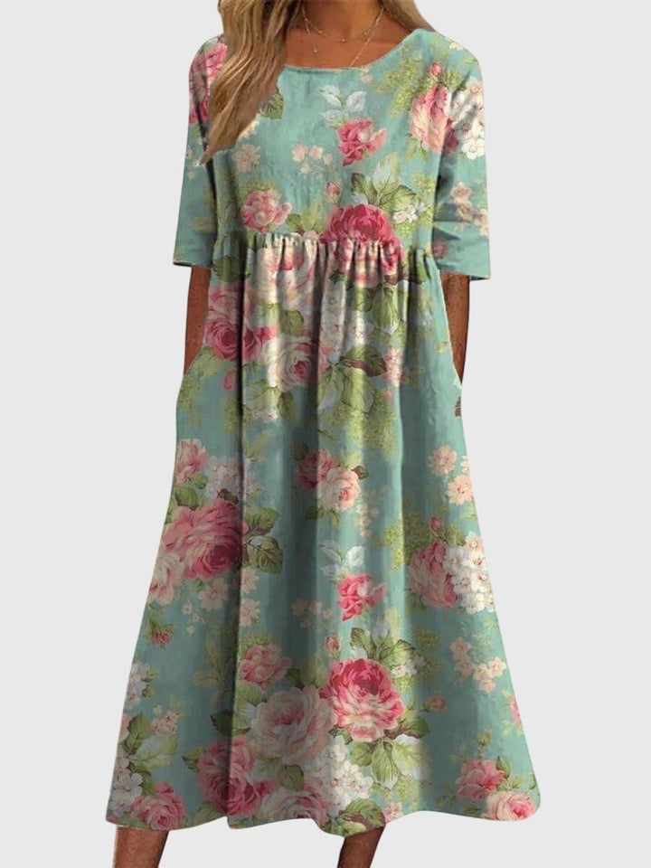 sage green midi dress with pink rose print and pockets