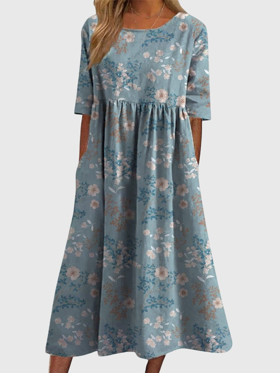 light blue midi dress with small floral branch pattern