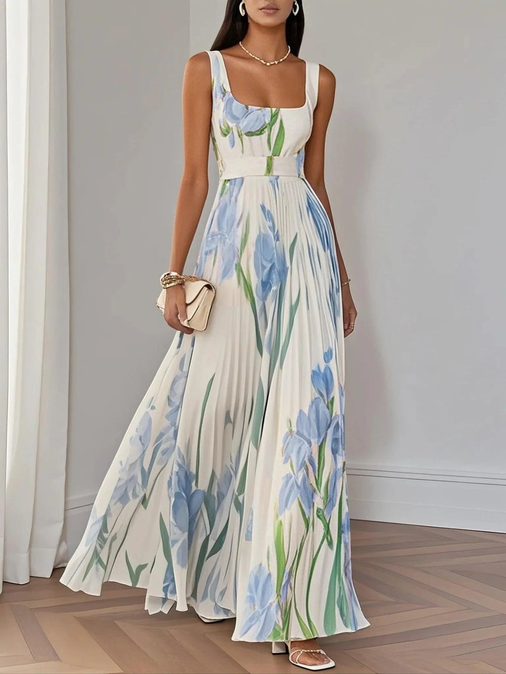 Sleeveless floral maxi dress in white with blue tulip print and belted waist