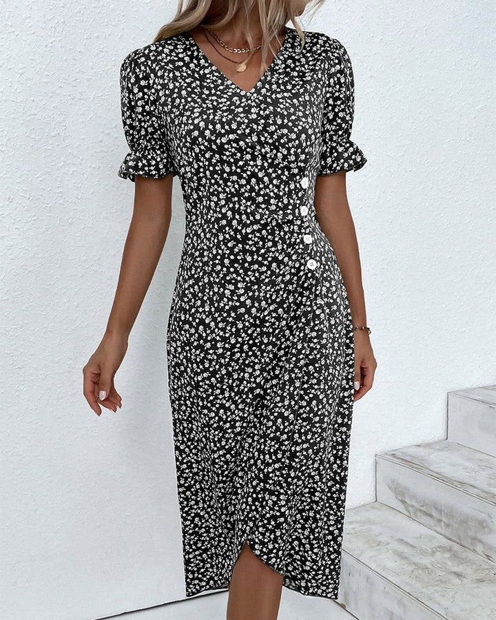 Black floral wrap dress with V-neck and ruffled sleeve cuffs