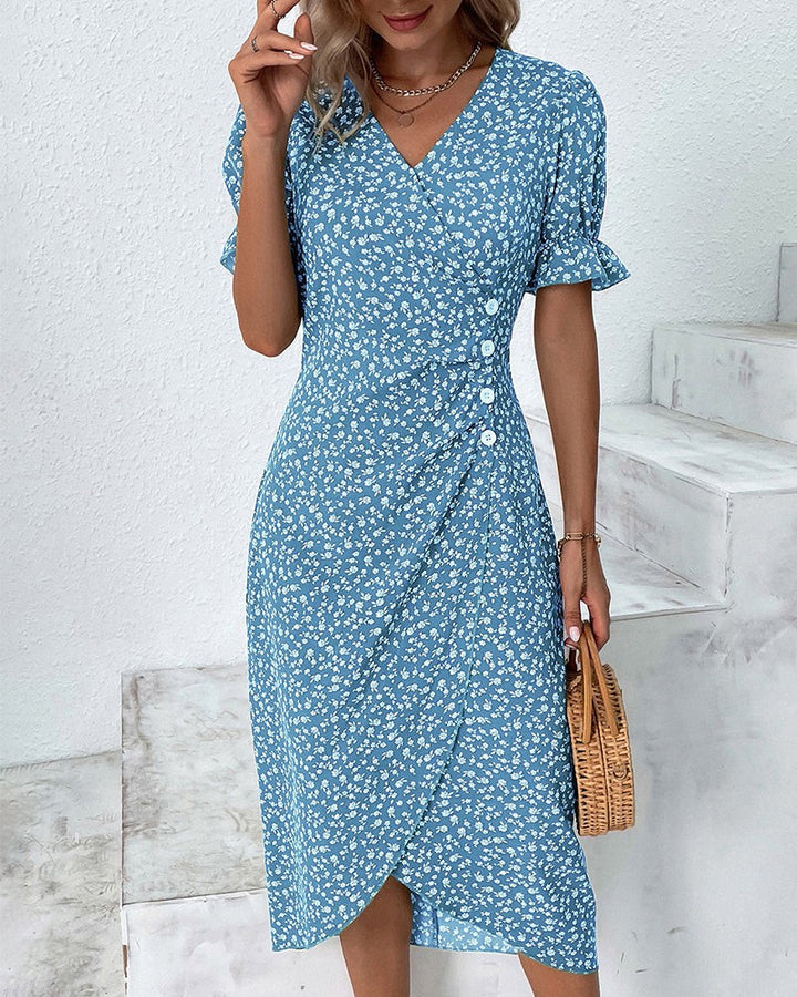 Blue floral V-neck midi dress with button detail and puff sleeves