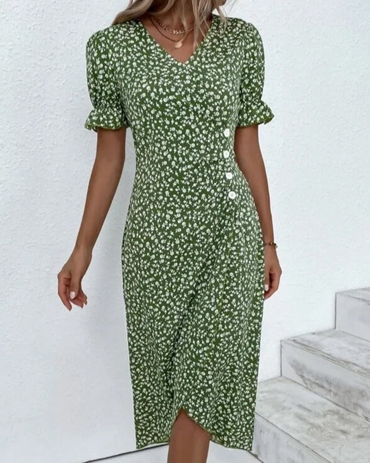 Green floral wrap dress paired with straw handbag, front view