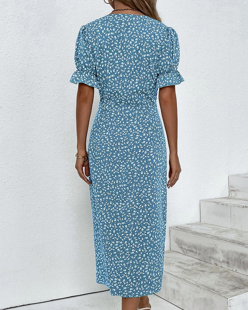 Blue ditsy floral dress with ruffle cuffs, back view