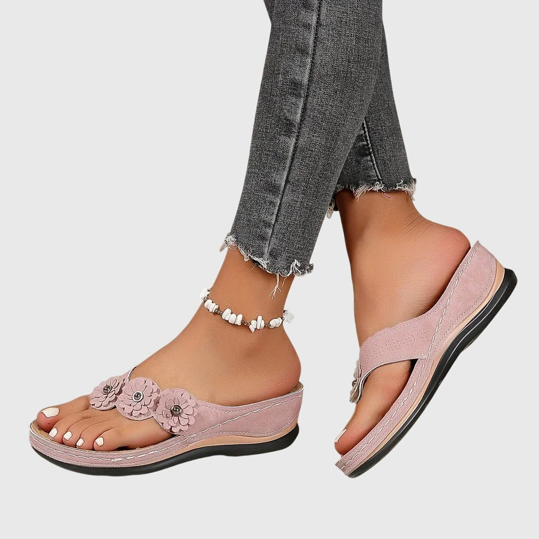 Dusty pink floral wedge sandals with crisscross toe strap design