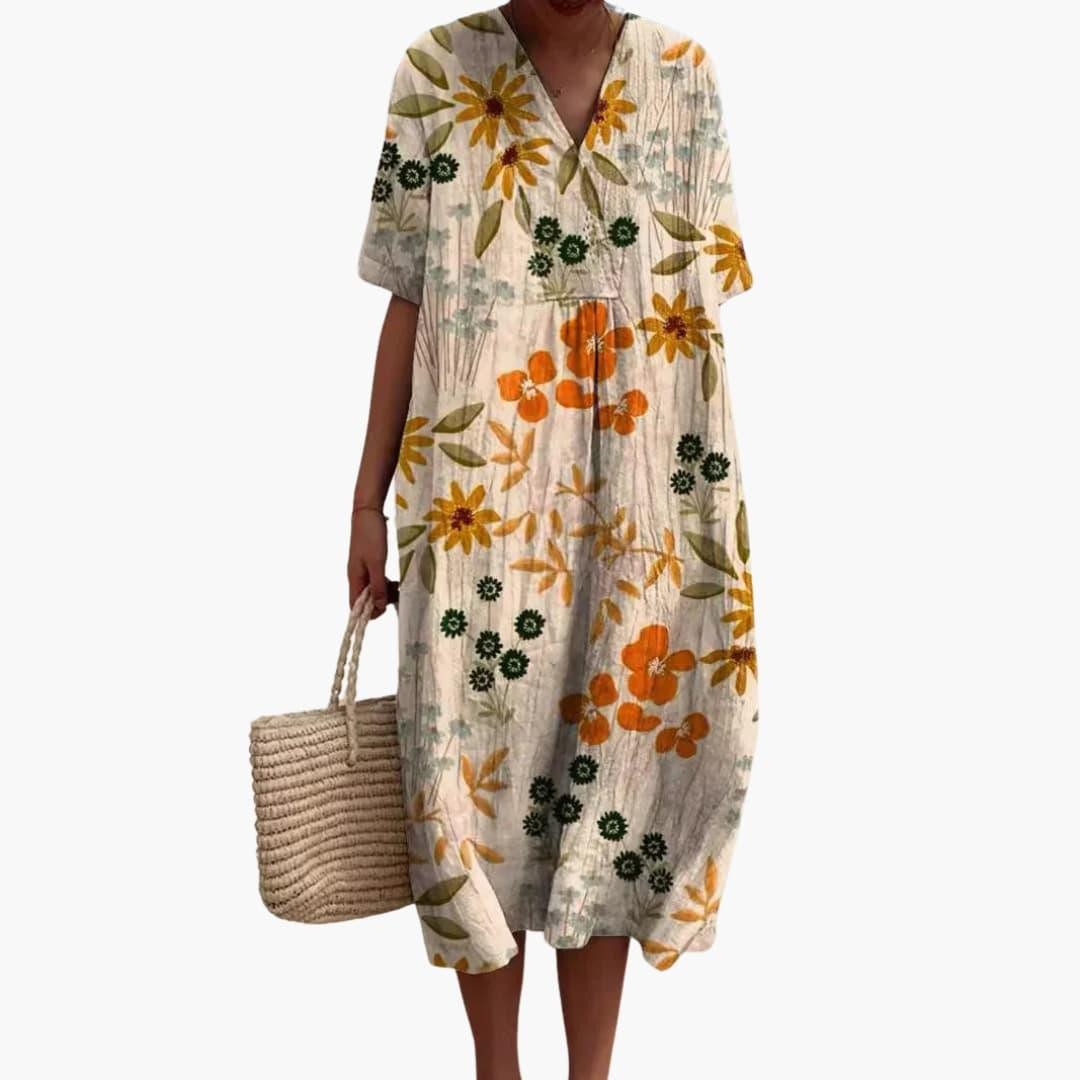 ivory floral midi dress featuring orange blossoms and short sleeves