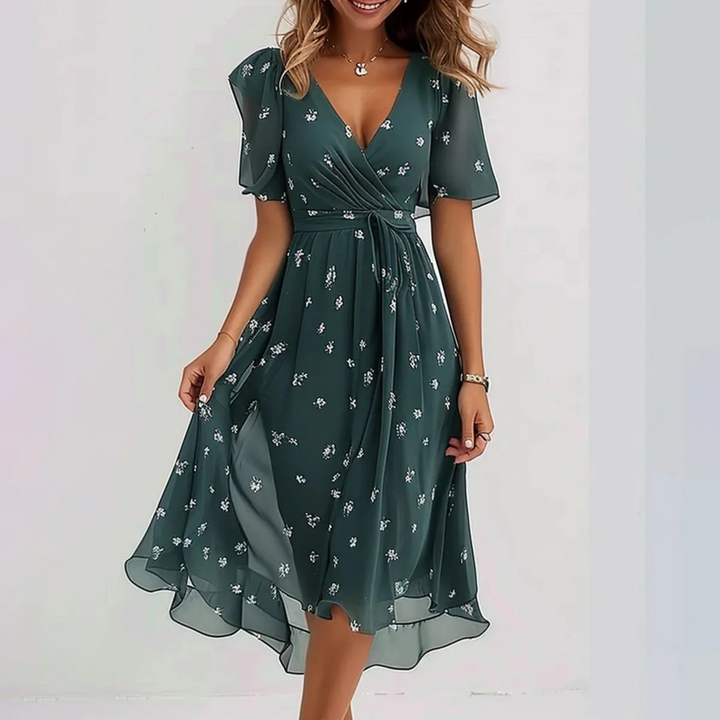 green floral chiffon wrap dress with flutter sleeves and tie waist