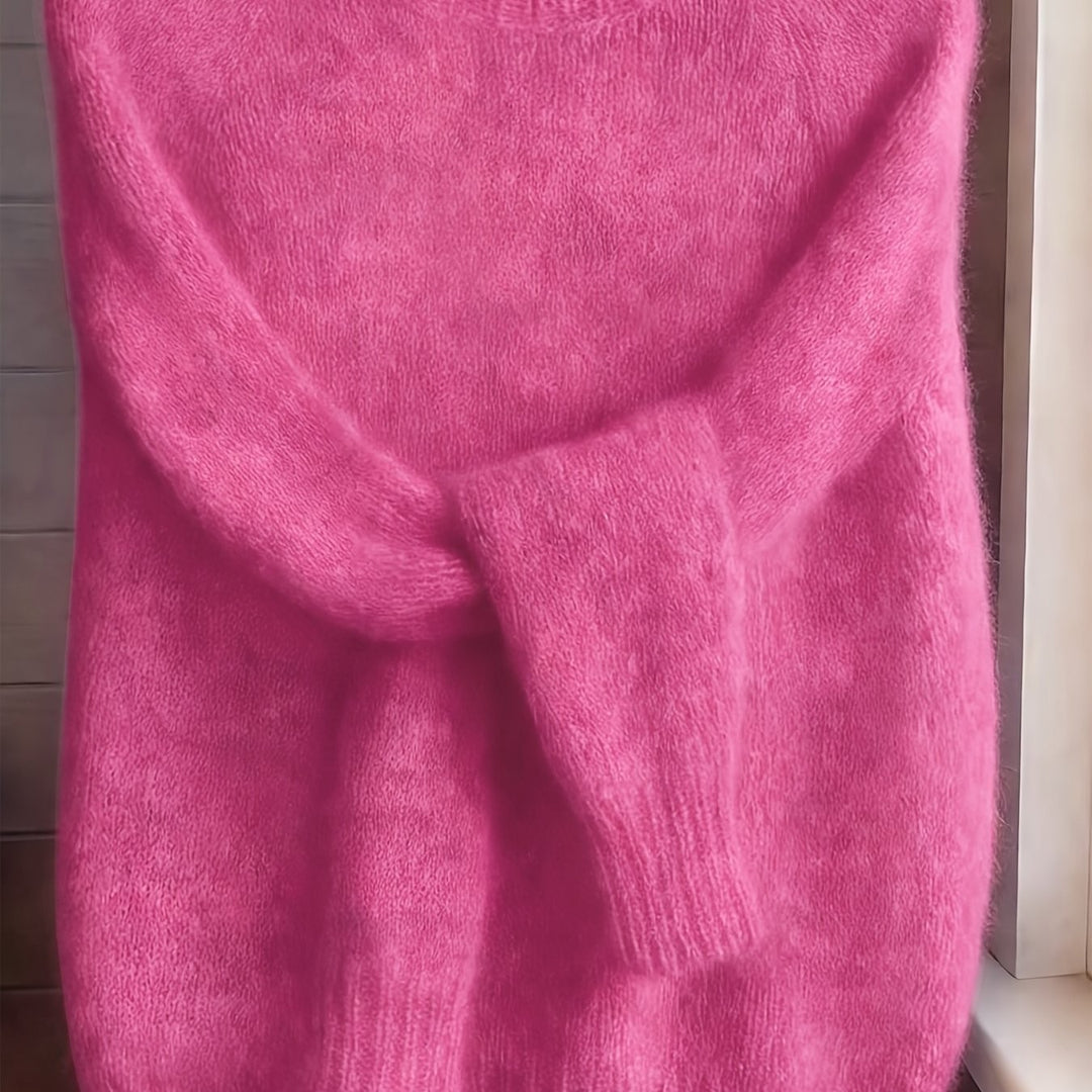 Close-up of hot pink fuzzy knit jumper showing plush textured knit