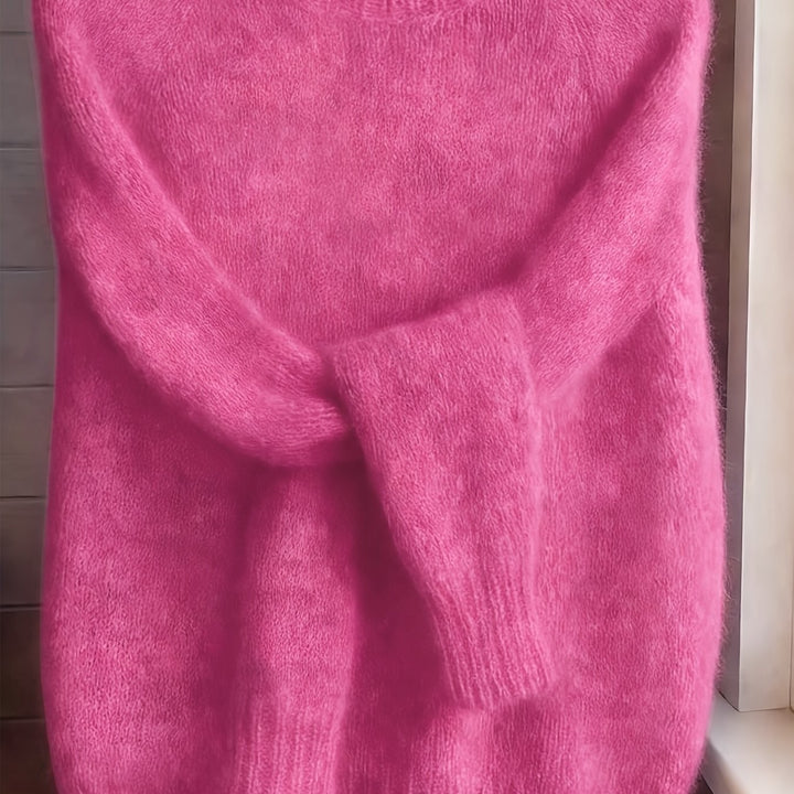 Close-up of hot pink fuzzy knit jumper showing plush textured knit