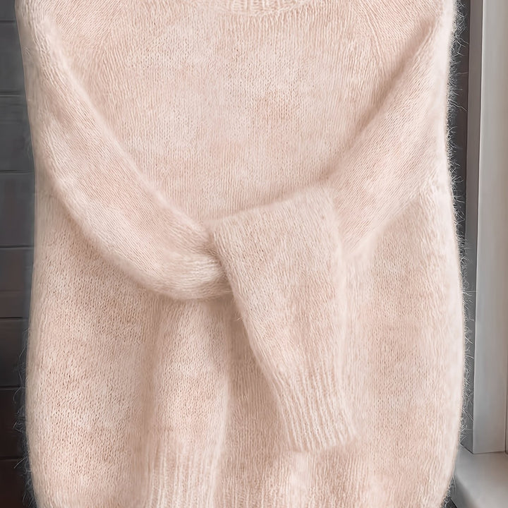 Close-up of blush pink fluffy knit jumper showing soft ribbed cuffs