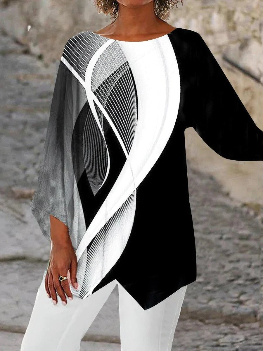 Black and white geometric print tunic top with asymmetric hem and long sleeves