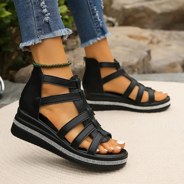 black caged wedge sandals with ankle zipper and glittery platform stripe