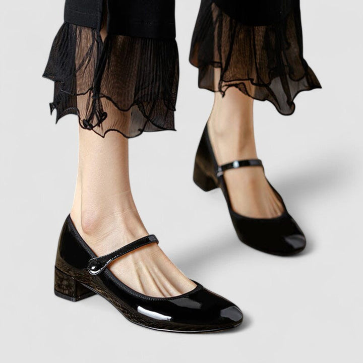 Black patent leather Mary Jane shoes with ankle strap and block heel