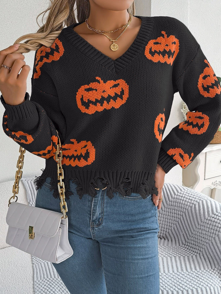 Back view of black sweater showing orange jack-o'-lantern print pattern