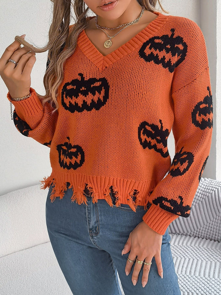 Gray V-neck sweater with orange jack-o'-lantern print and tattered edge