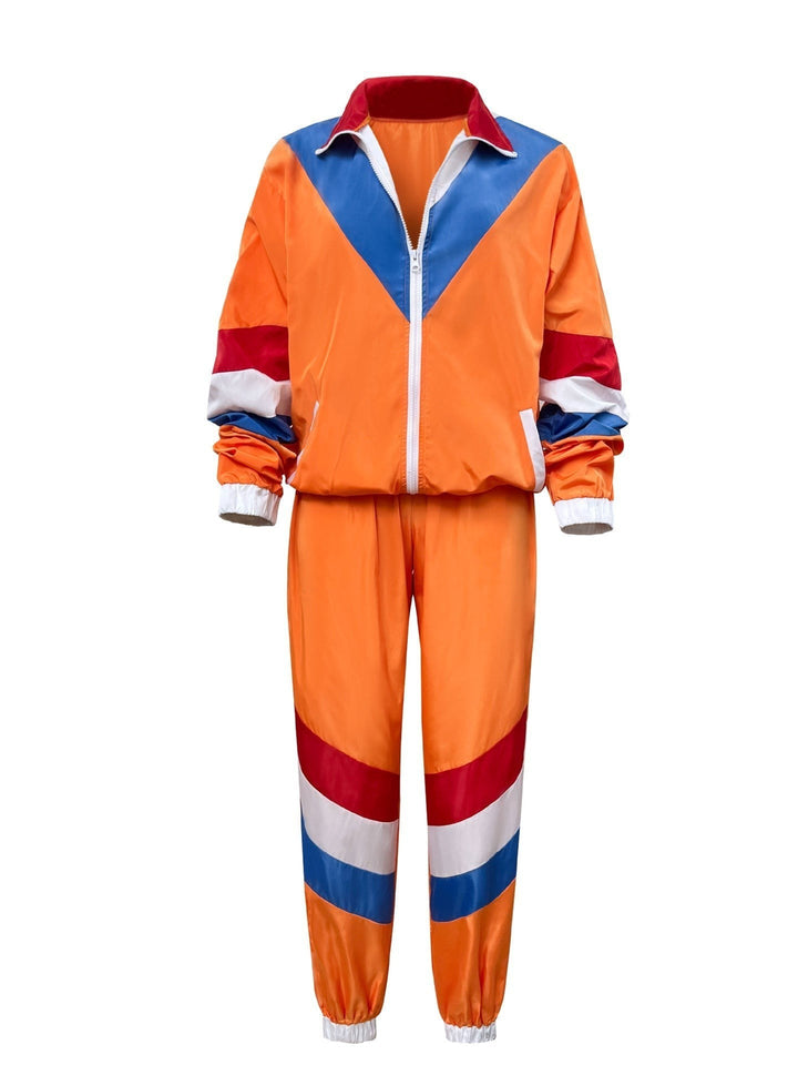 orange color-block track jacket and jogger set laid flat, front view
