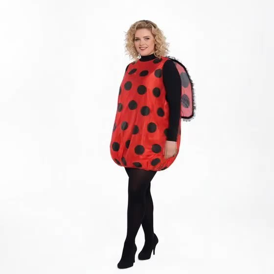 woman in ladybug costume dress paired with black tights and heels