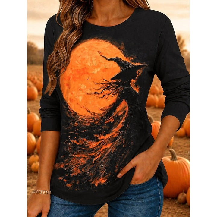 Black long-sleeve top with witch and orange moon Halloween graphic