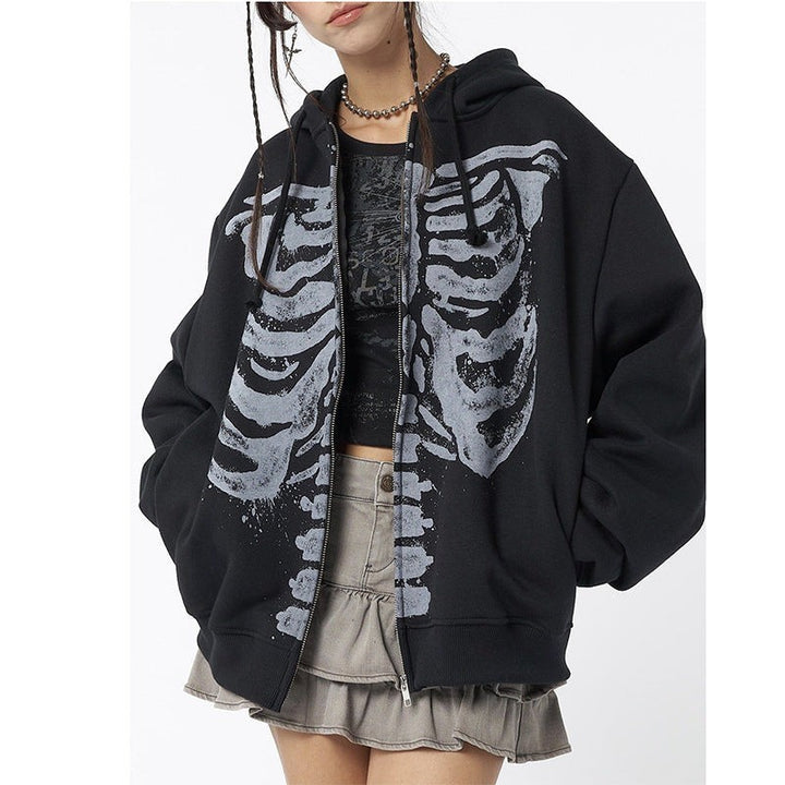 Unzipped black hoodie showing full skeleton rib cage graphic and drawstring hood
