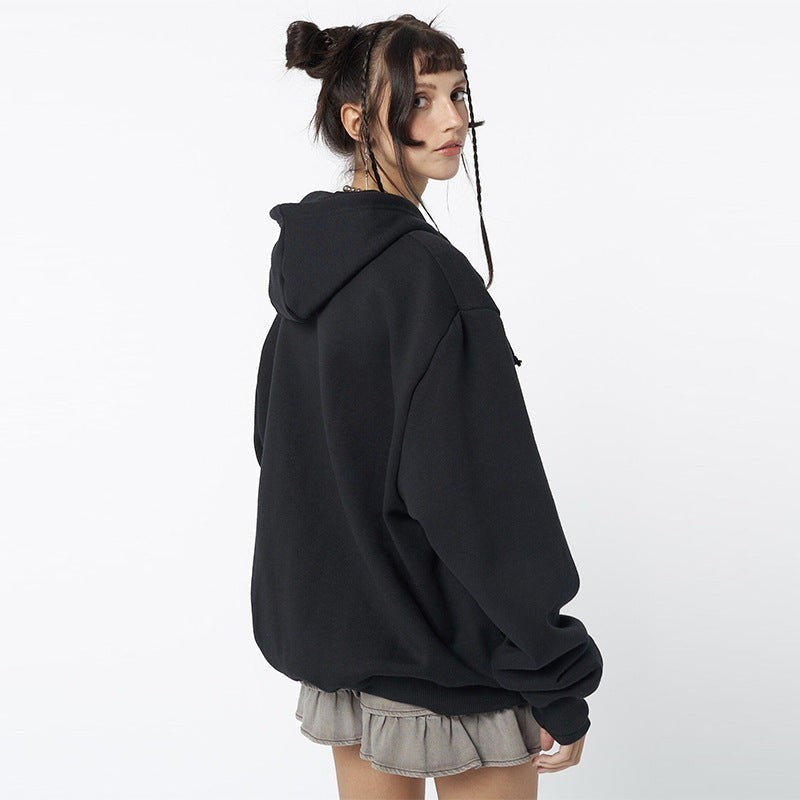 Back view of plain black oversized zip-up hoodie with drawstring hood