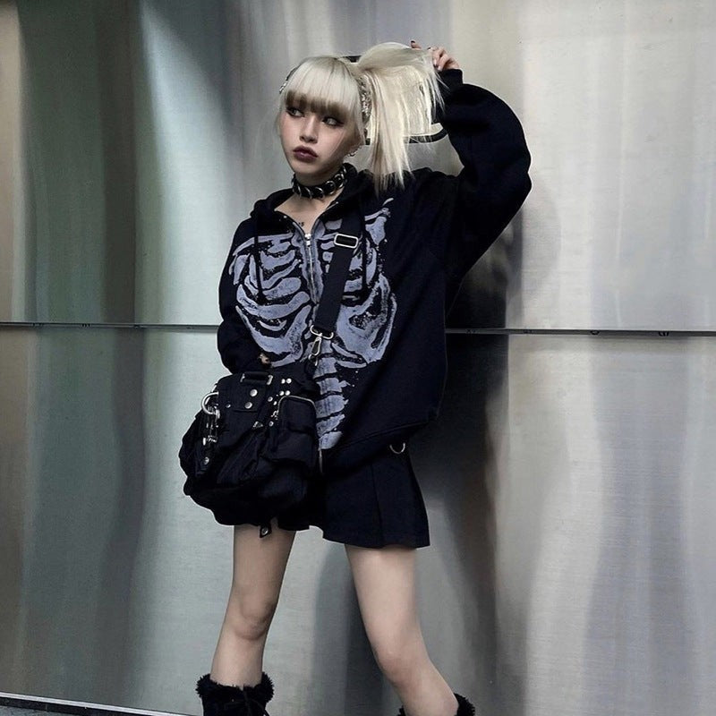 Cropped skeleton print zip-up hoodie styled with a black pleated mini skirt