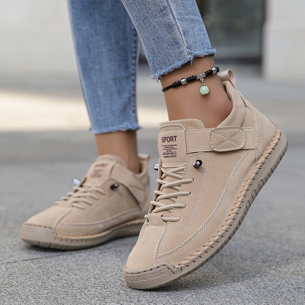 Beige suede sneakers with side strap and whip-stitched sole detail