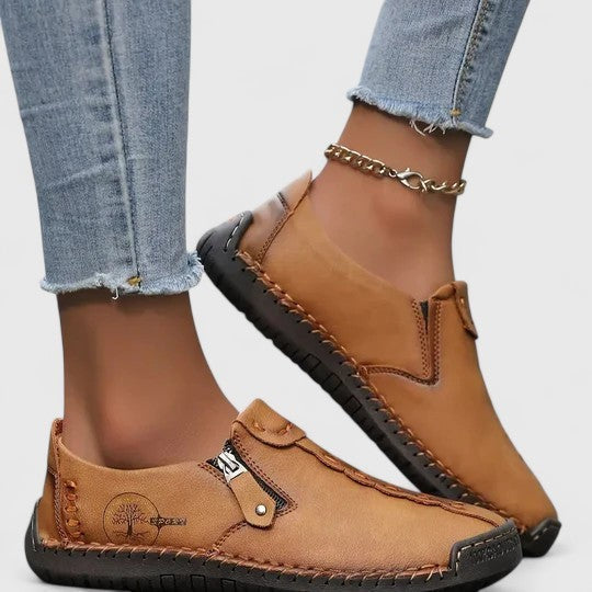 Camel brown leather slip-on sneakers with side zipper and stitched detailing