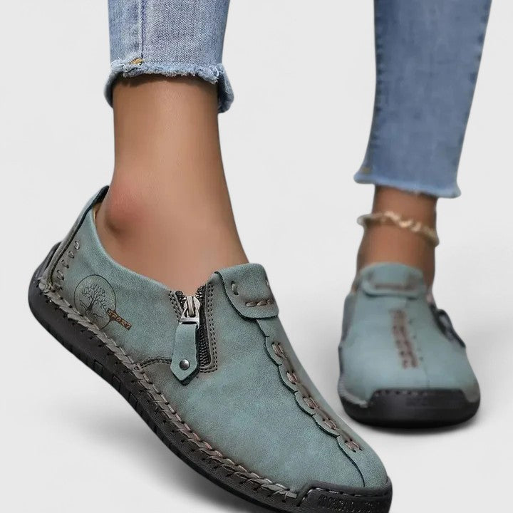 Sage green leather slip-on shoes with side zipper and contrast stitching
