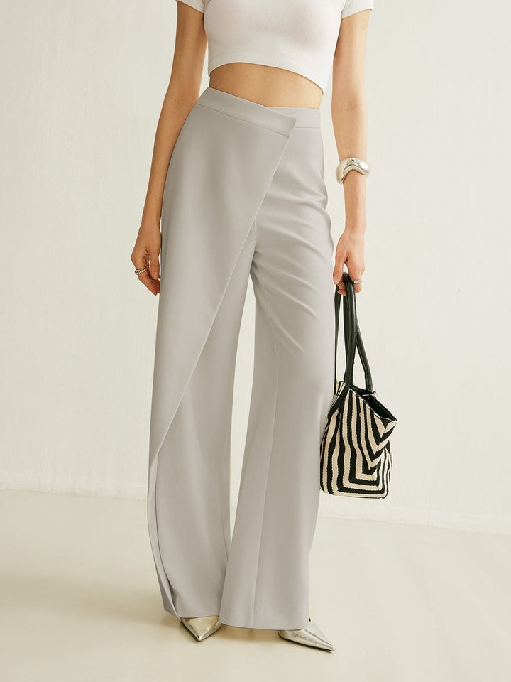 gray high-waisted wide leg pants featuring asymmetric wrap overlay