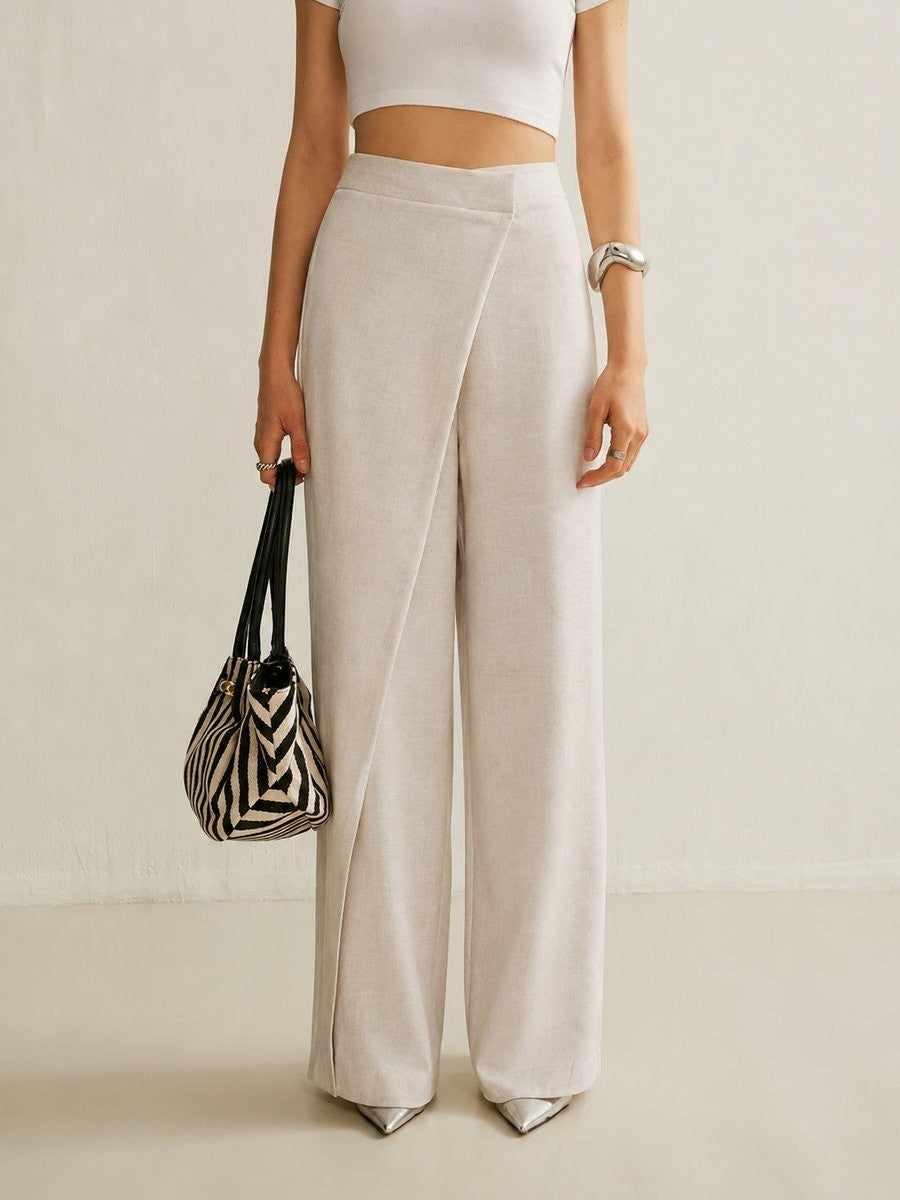 close-up of beige wide leg pants with crossover waist design