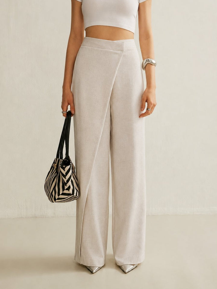 close-up of beige wide leg pants with crossover waist design