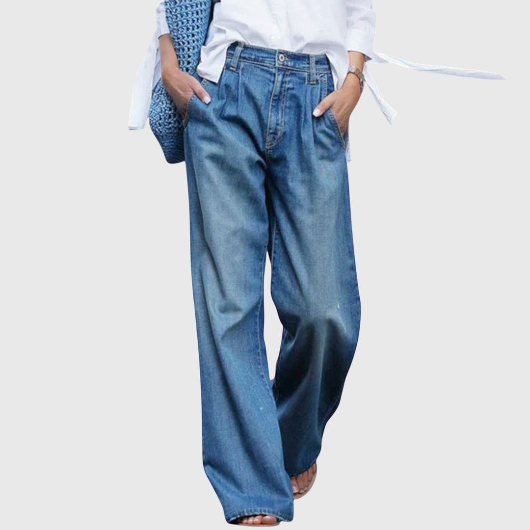 High-waisted wide-leg jeans in medium blue wash with pleated front detail