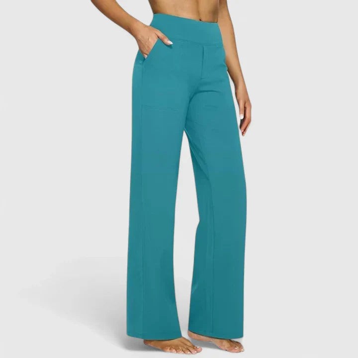 Teal high-waisted wide-leg pants with side pockets on model