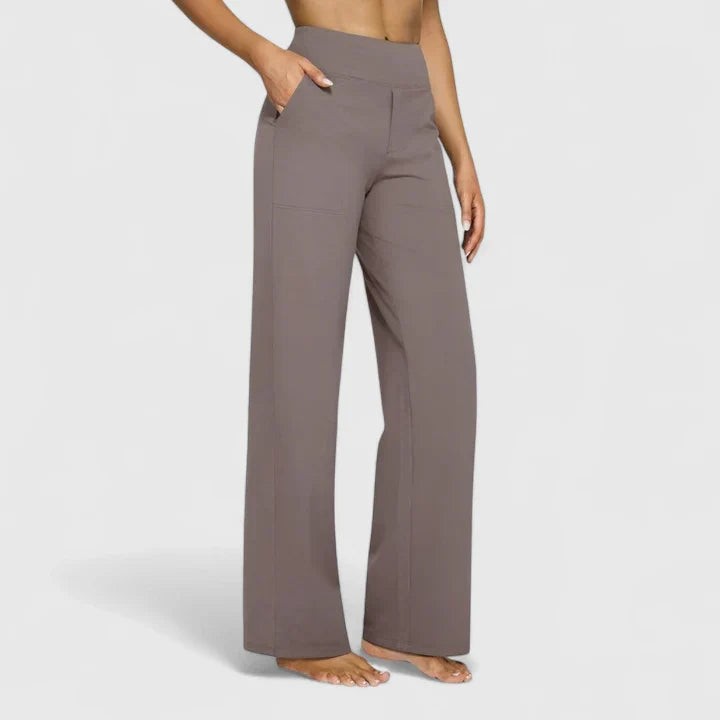 Taupe high-waisted wide-leg pants with side pockets on model