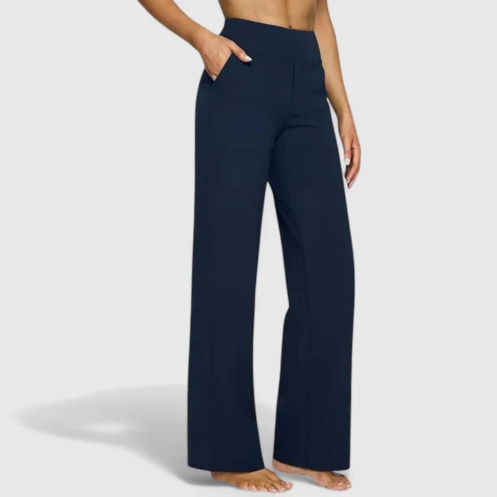 Navy blue high-waisted wide-leg pants with side pockets on model