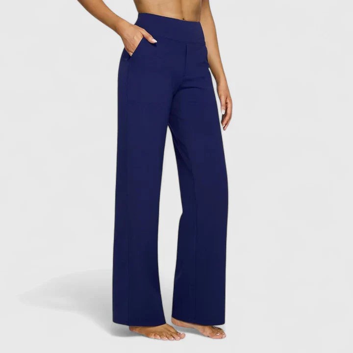 Navy high-waisted wide-leg pants with side pockets on model
