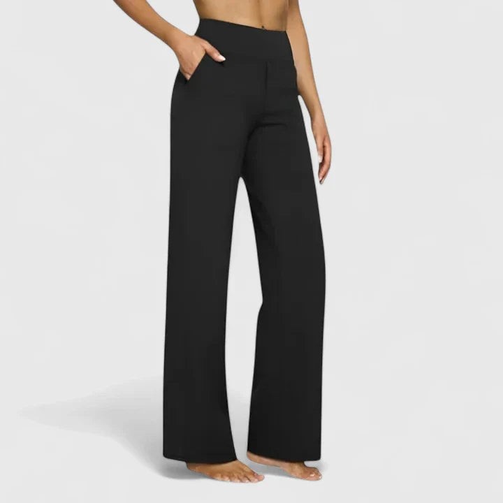 Black high-waisted wide-leg pants with side pockets on model
