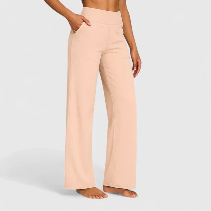 Peach high-waisted wide-leg pants with side pockets on model