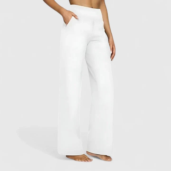 White high-waisted wide-leg pants with side pockets on model