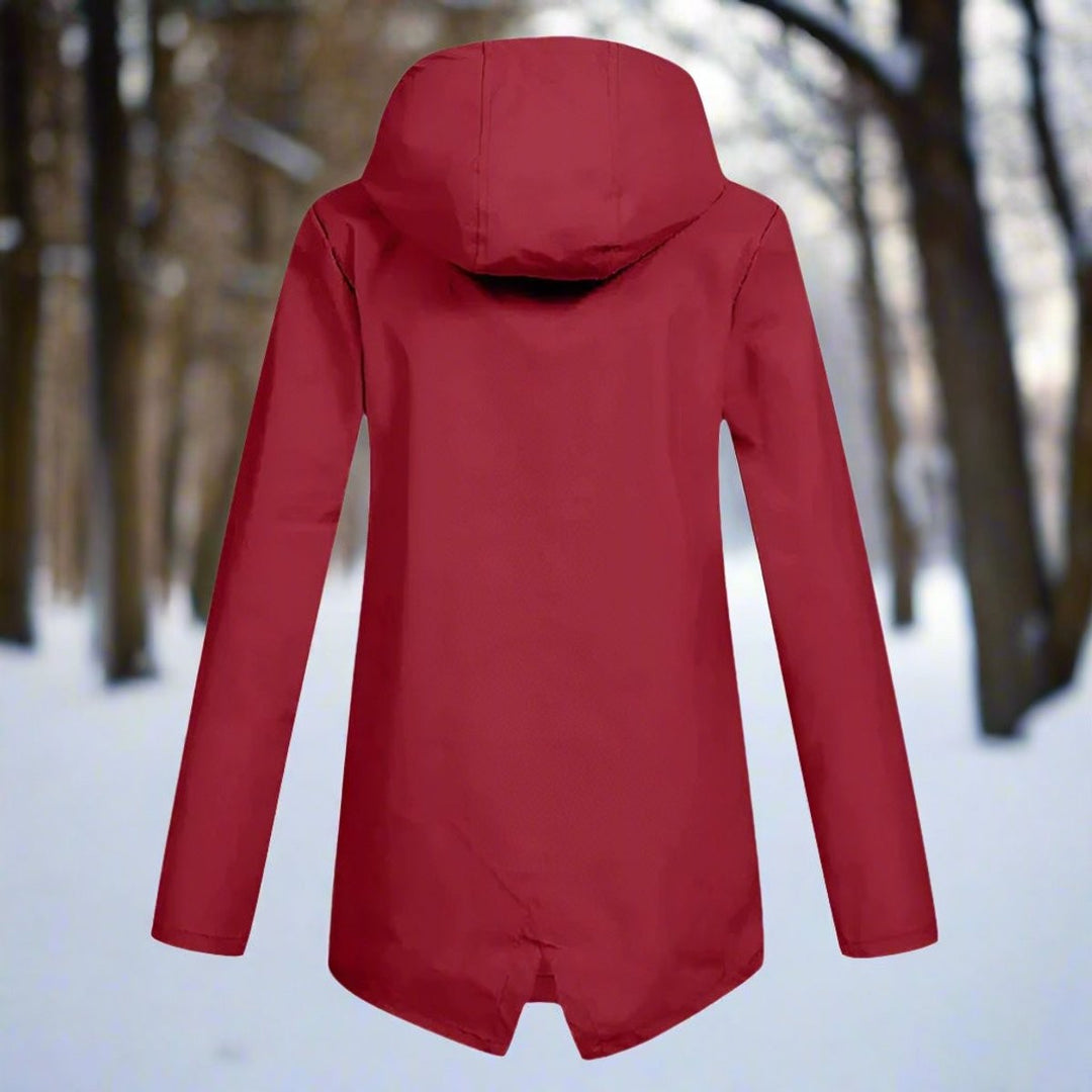 Red hooded rain jacket back view with longline cut in snowy woods