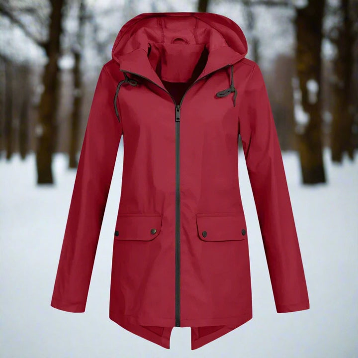 Red longline rain jacket, front view with hooded design and snap pockets