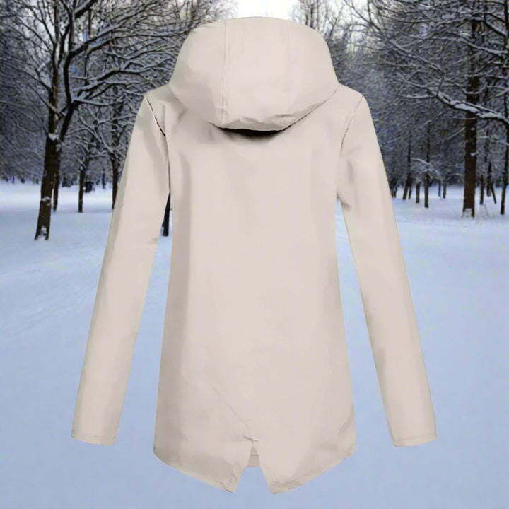 Beige hooded rain jacket back view showing longline hem and drawstring hood