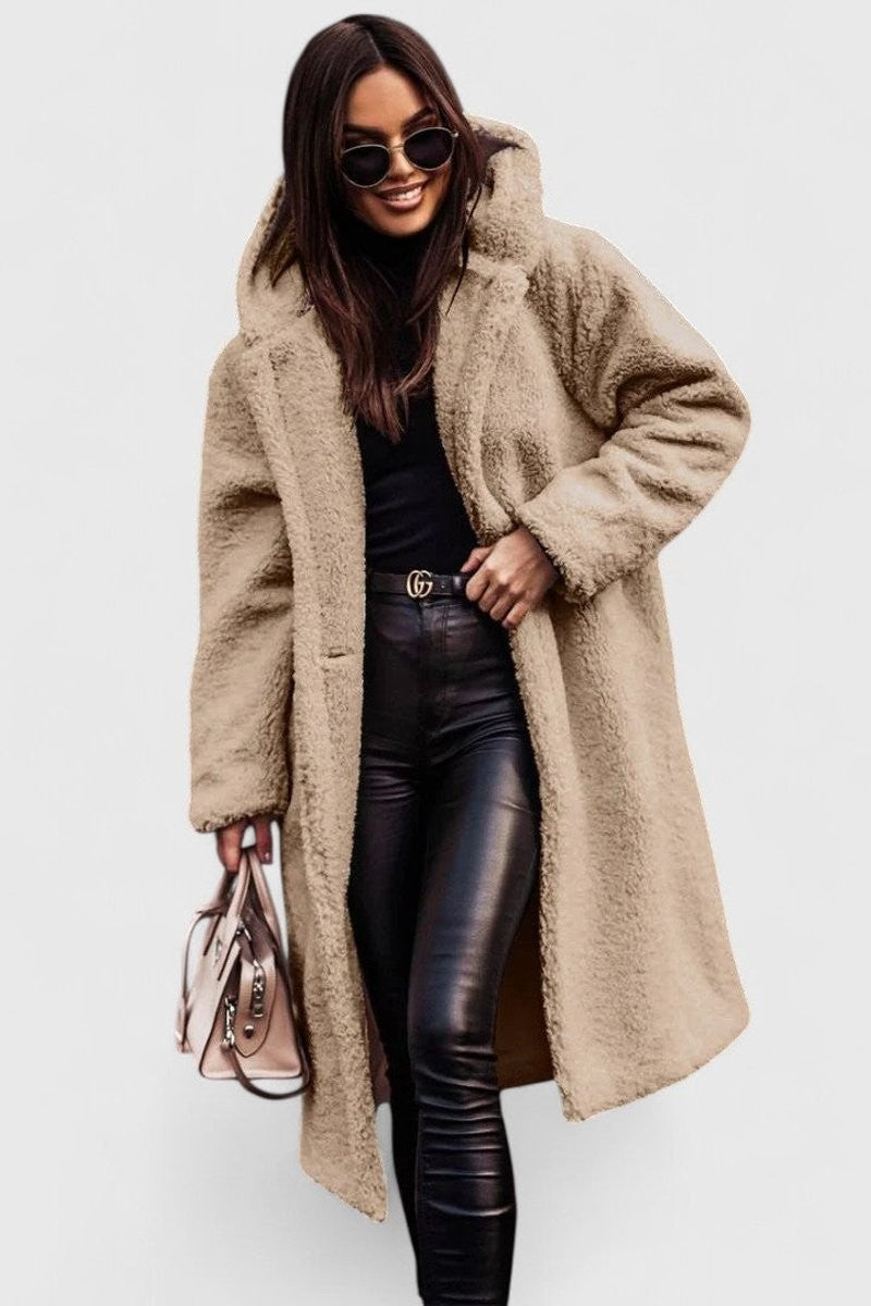Beige oversized hooded teddy coat styled with black leather leggings