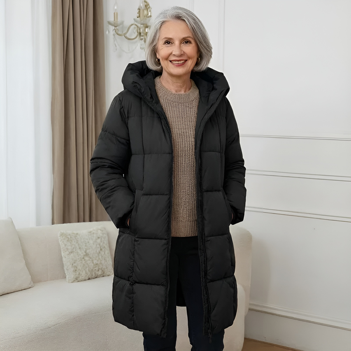 Black hooded puffer coat, knee-length quilted style over a sweater