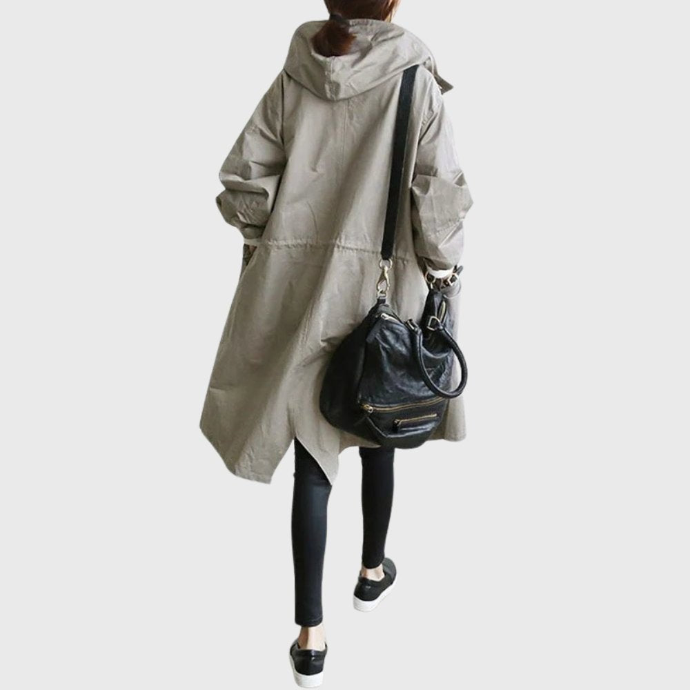 Taupe oversized hooded trench coat paired with a leather crossbody bag