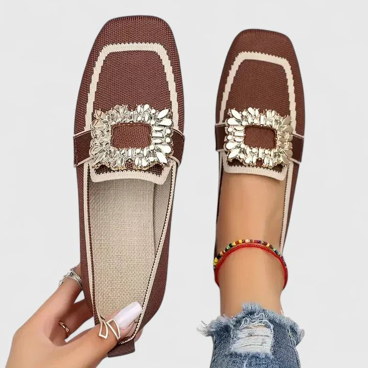 Brown knit loafers with tan trim and rhinestone buckle accent