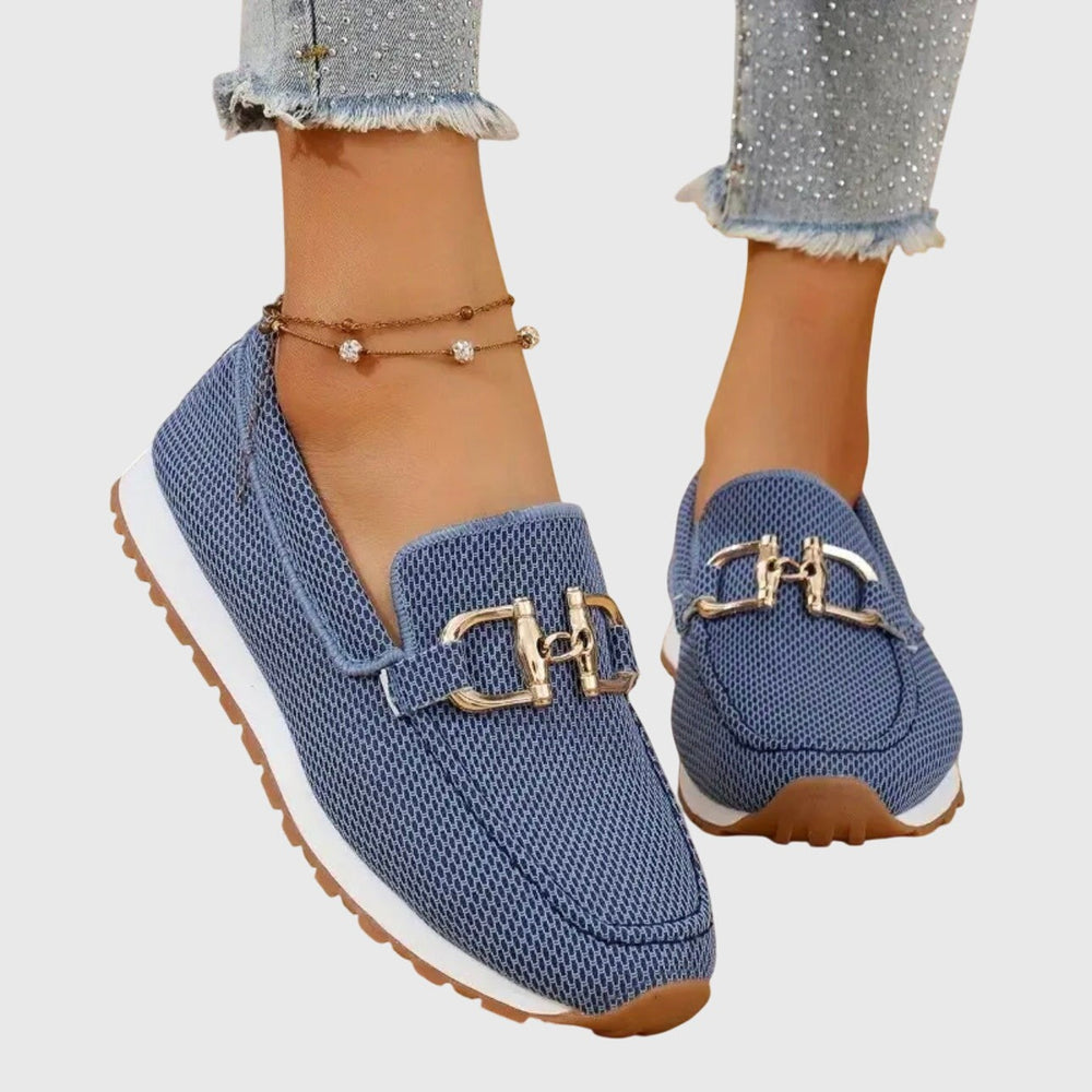 Blue knit loafers featuring gold horsebit accent and cushioned white sole
