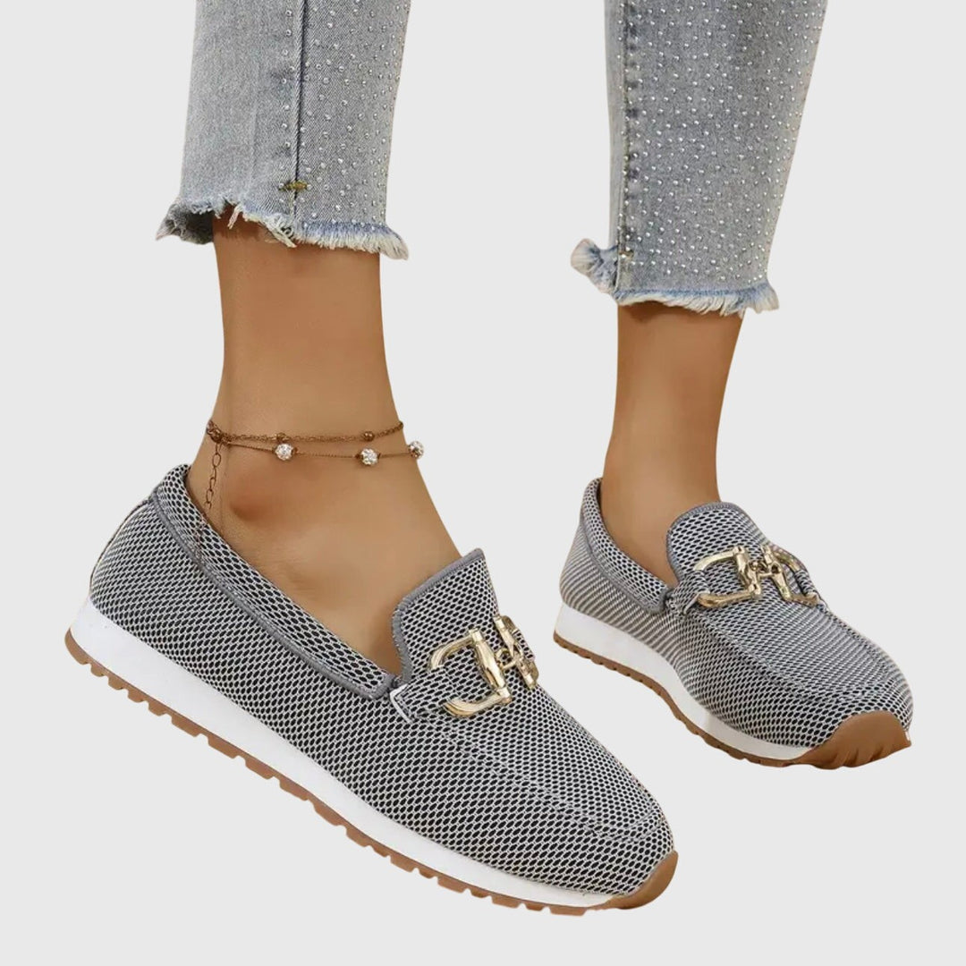 gray mesh platform loafers with gold buckle accent, worn on feet