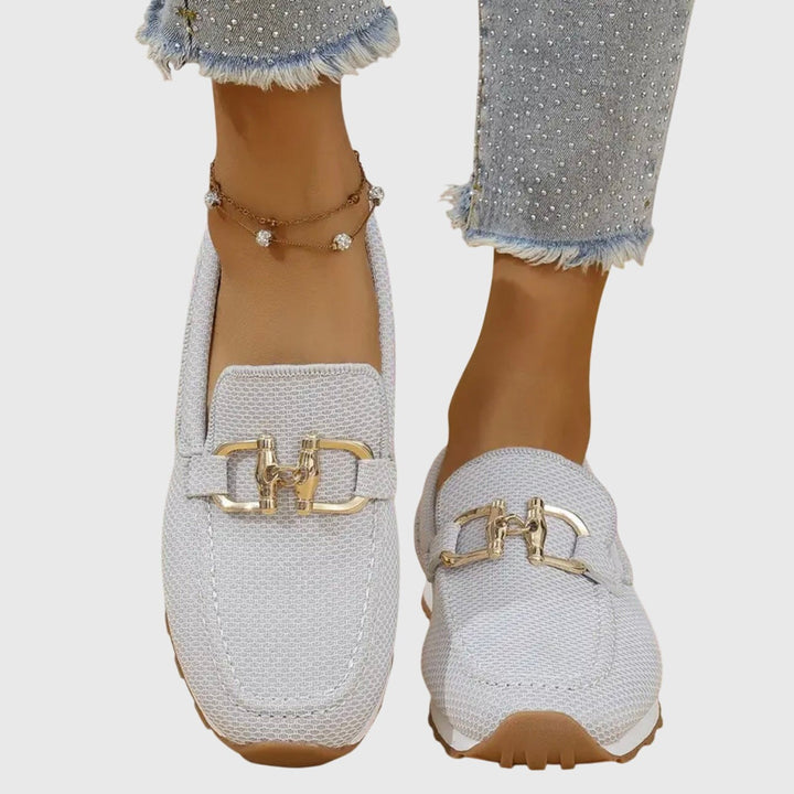 white mesh slip-on loafers with gold buckle and cushioned platform sole