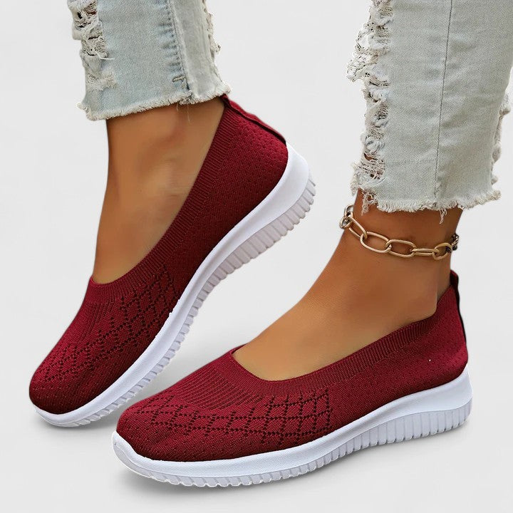 Burgundy knit slip-on sneakers with textured diamond pattern and white outsole