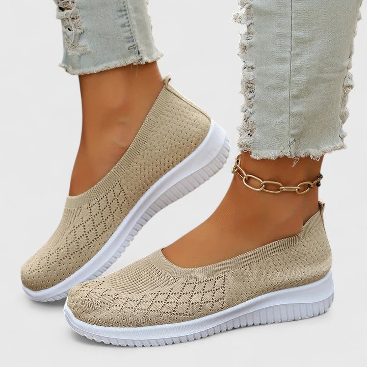 Beige knit slip-on sneakers with perforated design and lightweight white sole